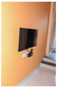 a flat screen tv hanging on a wall at MTDC Shivtej in Kolhapur