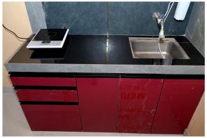 a kitchen counter with a sink and a sink at MTDC Shivtej in Kolhapur