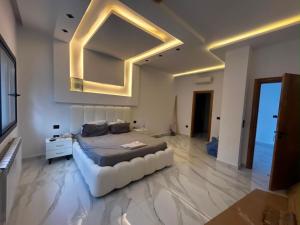 a large bedroom with a bed and a large mirror at Villa Zahra in Bizerte +12 photos