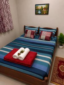 a bedroom with two beds with towels on them at Shiddi pelesh yatri niwas in Maihar