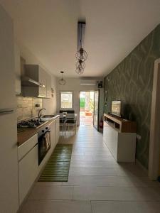 a kitchen with a sink and a stove at Alla Chiesetta in Naples +13 photos