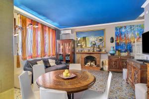 a living room with a table and a couch at Villa Fuenti Bay - Amalfi Coast in Cetara