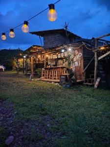 a building with lights on the side of it at เคียงสะปันโฮม&คาเฟ่ in Ban Huai Ti +19 photos