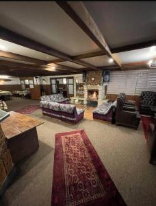 a large living room with couches and a fireplace at Mon Refuge 111-110 in Bcharré +5 photos
