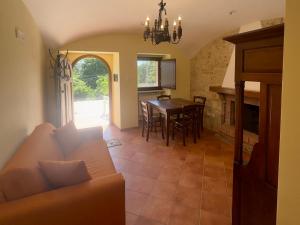 a living room with a couch and a table at La Sorgente Alta in Rocchetta a Volturno