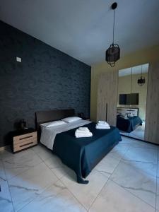 a bedroom with a large bed and a mirror at Alla Chiesetta in Naples