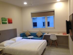 Rúm í herbergi á Ginger Bhubaneshwar