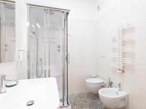 a bathroom with a shower and a toilet and a sink at Dadu 14 in Bari +29 photos