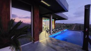 a swimming pool in a house with a view at Mycelio Atlantic Residence with Atlantic View in Ribamar