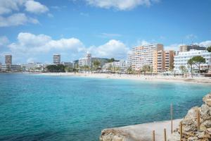 a view of a beach with buildings in the background at HSM Sandalo Beach in Magaluf