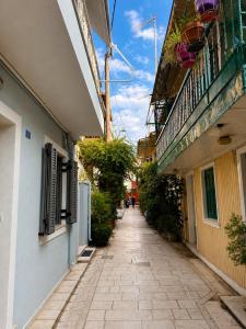an empty alleyway between two buildings on a street at Old Town Boutique Suites in Lefkada