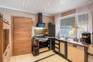 a kitchen with a stove and a counter top at Landleben 2 in Erkelenz