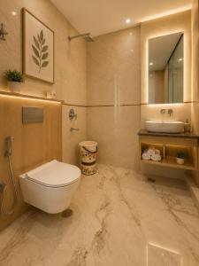 a bathroom with a toilet and a sink at Hotel Ve Atlantiis Elite in New Delhi