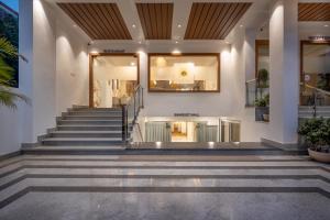 a set of stairs leading up to a building at Treebo Premium The Maulshri, Behind Health Vistaar City in Lucknow