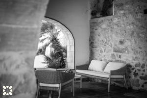 a porch with a couch and chairs and a plant at Villa Fantaxat by Abahana Villas in Benissa +27 photos
