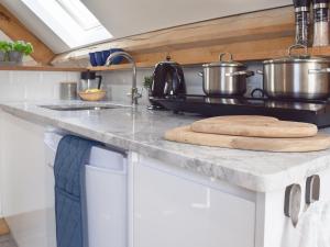 a kitchen counter with two pots and pans on it at Shepherd's Loft in Benson +10 photos