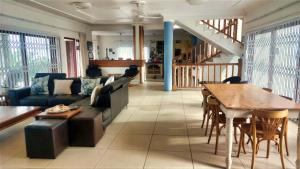 a living room with a couch and a table at The View in Port Alfred