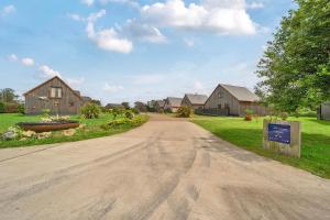 a dirt road in a residential neighborhood with houses at Pumpkin Lodge in Brigg