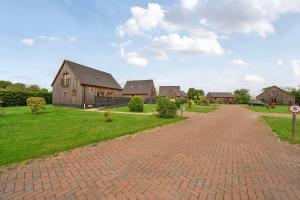 a brick road in front of a house at Pumpkin Lodge in Brigg +23 photos