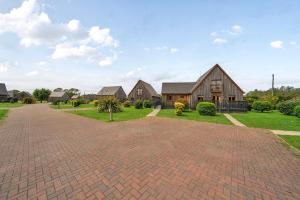a brick driveway in front of a house at Pumpkin Lodge in Brigg