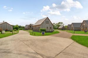 a driveway leading to a home with a barn at Pumpkin Lodge in Brigg
