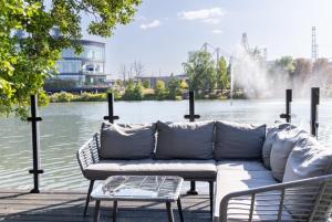 a couch sitting in front of a body of water at AvantGlamp in Marston Green