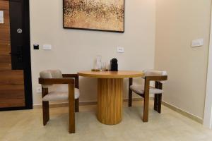 a wooden table and chairs in a room at Dream Palace 1 in Belgrade +2 photos