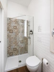a white bathroom with a shower and a toilet at Eccelsoleccese Boutique B&B - steps from the Historic Center in Lecce +53 photos