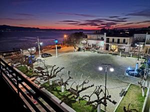 a view of a parking lot at night at Evia Plaza Suites in Amarynthos