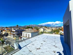 a view of a city from the roof of a building at Evia Plaza Suites in Amarynthos