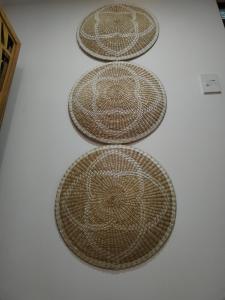 four brown baskets sitting on top of a table at Carribean Boutique Hostel in San José +107 photos
