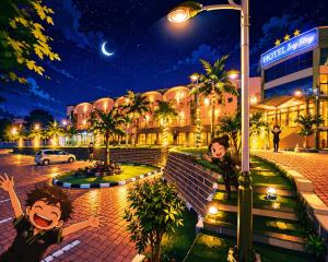 two children standing in front of a building at night at Hotel Izzy Stay in Maputo