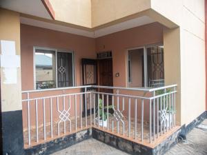 a balcony of a house with a balcony railing at Queen Tori in Malindi