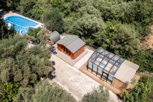 an overhead view of a house with a swimming pool at Apanema Mindfulness, Relaxing Adults Only Resort, Fast WiFi, Pool, Sauna, Massage in Asprogerakata +78 photos