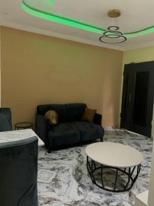 a living room with a couch and a table at E&G homed in Lagos