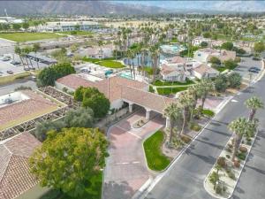 an aerial view of a residential neighborhood with palm trees at Desert Breezes Resort in Palm Desert