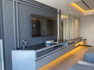 a bathroom with a sink and a mirror at PISO 13 SM Living Street Mall in Puebla +48 photos