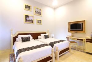 Cama o camas de una habitación en Java Villas Boutique Hotel & Resto