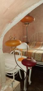 a room with a bed and a table and two chairs at Chambres d'Hôtes de La Vallée Du Serein in Annay-sur-Serein