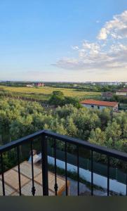 a balcony with a view of a field and a river at Spille Residence in Spille