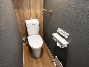 a bathroom with a white toilet in a stall at Akatsuki Villa 暁 in Asahikawa +3 photos