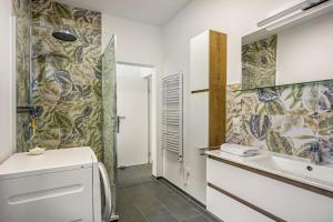 a bathroom with a sink and a shower at Romy in Reischach
