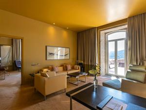 a living room with a couch and a table at Pestana Palacio do Freixo, Pousada & National Monument - The Leading Hotels of the World in Porto
