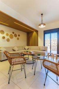 a living room with a couch and tables at Echo 1-BR Apartment In Ejdabra Batroun 