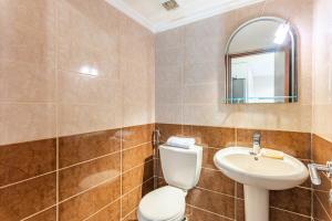 a bathroom with a toilet and a sink at Echo 1-BR Apartment In Ejdabra Batroun  +19 photos