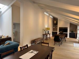 a living room with a couch and a table at Upper Constantia Entertainers dream! in Cape Town