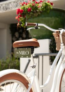 a white bike with a mio sign on the back at The Milo in Santa Barbara