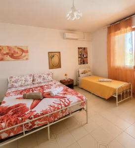 a bedroom with a bed and a chair in it at Lello's Dream House in Càbras