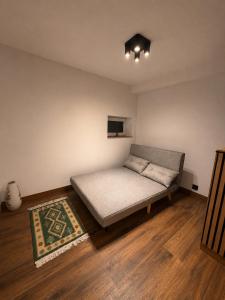 a bedroom with a bed in a room at Pretty House in Słupsk