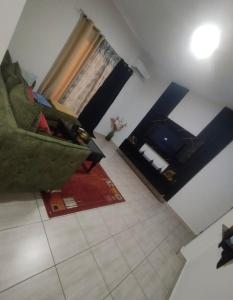 a living room with a couch and a fireplace at La pace in Libreville +1 photo